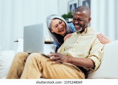 Cinematic image of an happy multiethnic senior couple. Indoors Lifestyle moments at home. Concept about seniority and relationships - Shutterstock ID 2191248069