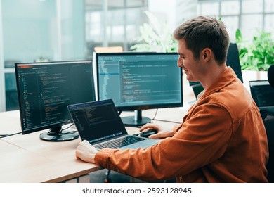 Cinematic image of a programming office with young programmers working on a new project for a start up business. - Powered by Shutterstock - Get 15% off with code: PIKWIZARD15