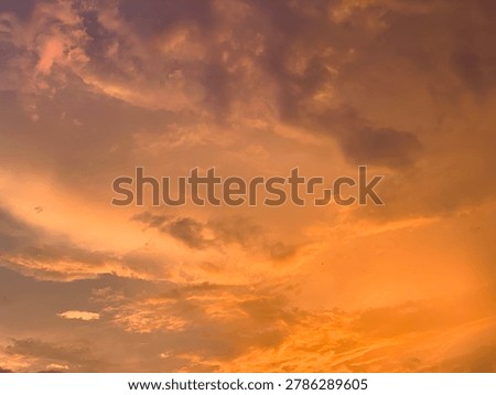 Cinematic orange sunset clouds with dramatic pastel sky and soft texture, captured in wide-angle focus. Perfect for luxury branding, wellness ads, travel banners and aesthetic wallpapers.