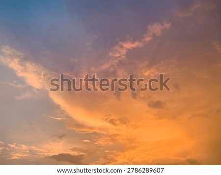 Cinematic orange sunset clouds with dramatic pastel sky and soft texture, captured in wide-angle focus. Perfect for luxury branding, wellness ads, travel banners and aesthetic wallpapers.
