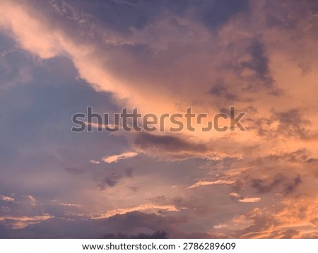 Cinematic orange sunset clouds with dramatic pastel sky and soft texture, captured in wide-angle focus. Perfect for luxury branding, wellness ads, travel banners and aesthetic wallpapers.