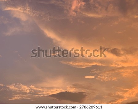 Cinematic orange sunset clouds with dramatic pastel sky and soft texture, captured in wide-angle focus. Perfect for luxury branding, wellness ads, travel banners and aesthetic wallpapers.