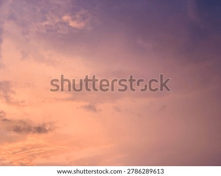 Cinematic orange sunset clouds with dramatic pastel sky and soft texture, captured in wide-angle focus. Perfect for luxury branding, wellness ads, travel banners and aesthetic wallpapers.