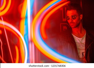 Cinematic Portrait Of Handsome Man With Sunglasses And Neon Ligh