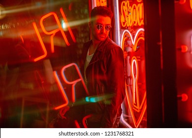 Cinematic Portrait Of Handsome Man With Sunglasses And Neon Ligh