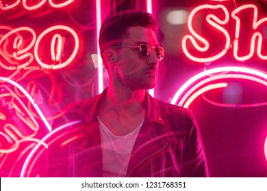 Cinematic Portrait Of Handsome Man With Sunglasses And Neon Ligh