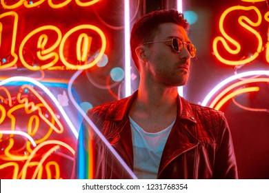 Cinematic Portrait Of Handsome Man With Sunglasses And Neon Lights