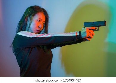 Cinematic Portrait Of Young Attractive And Dangerous Special Agent Woman Spy Or Asian Korean Mobster Girl Holding Handgun Pointing The Gun Fierce In Hollywood Movie Style