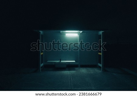 A cinematic shot of an empty bus stop at night with a light on