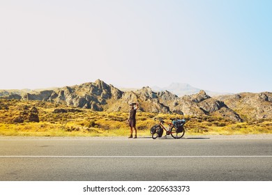 Cinematic Travel Inspirational Panorama Caucasian Traveler Cyclist Stand On Road Take Smiley Self-portrait With Mobile Phone. Solo Travel Bicycle Touring Around The World