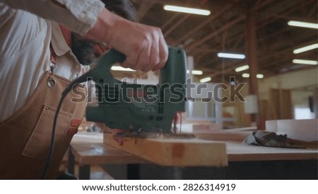 Cinematic View Of Man Working in Carpentry Workshop