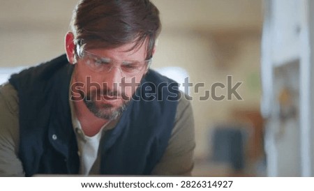 Cinematic View Of Man Working in Carpentry Workshop