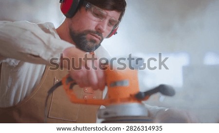 Cinematic View Of Man Working in Carpentry Workshop