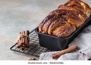Cinnamon babka or swirl brioche bread. Cinnamon roll bread. Povitica: traditional Polish sweet bread. Homemade pastry for breakfast. Selective focus.
