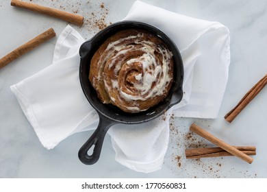 Cinnamon Bun Baked In Cast Iron Fry Pan Skillet.