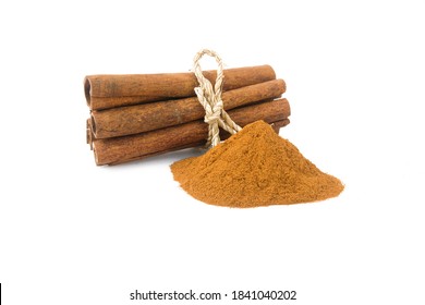 Cinnamon ground and cinnamon stick tied up with burlap rope, isolated on white background. Winter spices. - Powered by Shutterstock