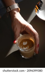 Cinnamon Macchiato In A Glass Beaker In The Cafe
