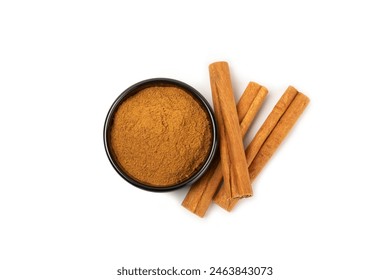 Cinnamon powder in a bowl isolated on white background. Spicy spice for baking, desserts and drinks. Fragrant ground cinnamon. - Powered by Shutterstock