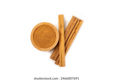 Cinnamon powder in a bowl isolated on white background. Spicy spice for baking, desserts and drinks. Fragrant ground cinnamon. - Powered by Shutterstock