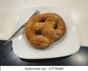 Cinnamon Pretzel With Cream Cheese On A Plate