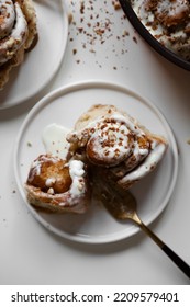 Cinnamon Roll With Mascarpone Cream On Plate, Appetizing Homemade Pastries, Sweet Baking Bun, Dessert Close Up, White Background, Top View, Flat Lay