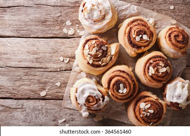 Cinnamon rolls with almond on the table. horizontal top view