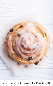 Cinnamon Rolls Buns On A White Marble Wooden Background. Bakery Concept. Breakfast And Brunch. Flatlay. Minimalistic Photo. Overhead. Copy Space