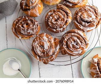 Cinnamon Rolls On White Table. Closeup And Overhead View