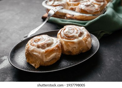 Cinnamon Sinnabon Bun, With Vanilla Fudge On A Dark Background.