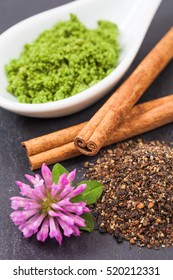 Cinnamon, Spice Mix, Nettle Powder And Clover Flower (on Slate)