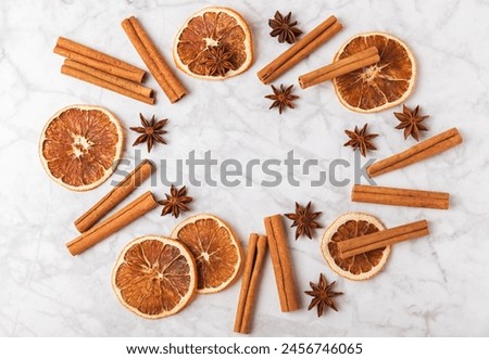 Cinnamon sticks and anise on a textured background. Cinnamon roll and star anise. Spicy spice for baking, desserts and drinks. Fragrant ground cinnamon.Place for text. copy space.