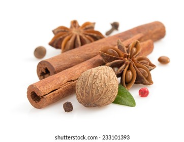 cinnamon sticks, anise star and spices on white background - Powered by Shutterstock