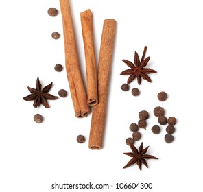 Cinnamon sticks, anise stars and black peppercorns. Isolated on white background - Shutterstock ID 106604300