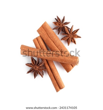 Cinnamon sticks and anise stars isolated on white, top view