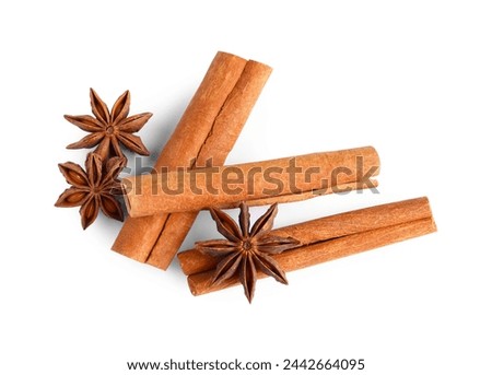 Cinnamon sticks and anise stars isolated on white, top view