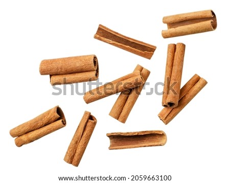 Cinnamon sticks falling close-up on a white background, cut. Isolated