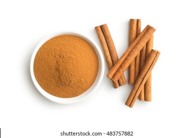 Cinnamon sticks and ground cinnamon isolated on white background. Top view. - Powered by Shutterstock