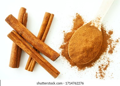 Cinnamon Sticks And Ground Cinnamon On A White Background