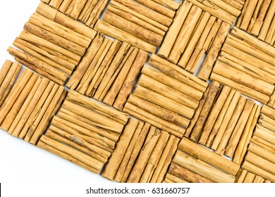 Cinnamon sticks isolated on white background cutout. Top view in focus. Wooden tasty bark spices. Seamless closeup texture material