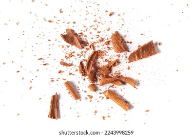 Cinnamon sticks, pieces with shavings isolated on white, top view - Shutterstock ID 2243998259