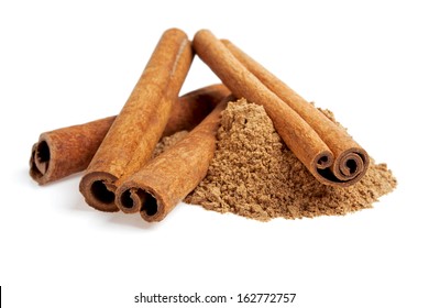 Cinnamon sticks and powder on white background - Shutterstock ID 162772757