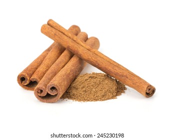 Cinnamon sticks with powder on white background - Shutterstock ID 245230198