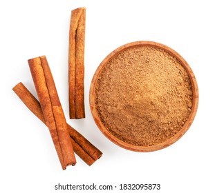 Cinnamon sticks and cinnamon powder in a plate on a white background, isolated. The view from top - Shutterstock ID 1832095873