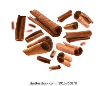 Cinnamon sticks in the shape of a heart on a white background