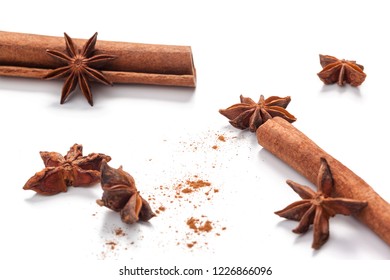 Cinnamon sticks and star anise isolated on white background - Shutterstock ID 1226866096