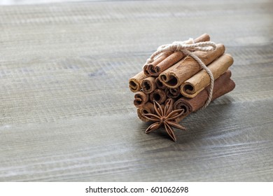cinnamon sticks and star anise on wooden board. copy space - Shutterstock ID 601062698