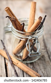 Cinnamon And Vanilla Sticks In A Glass Jar