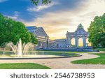 Cinquantenaire Arcade Neoclassical style, Autoworld Museum and fountain on sunset in Park of the Fiftieth Anniversary Jubelpark Jubilee Park in Brussels city, Brussels-Capital Region, Belgium