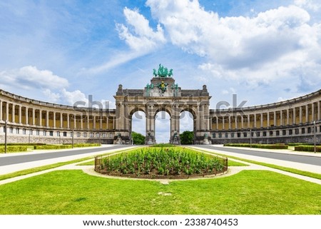 The Cinquantenaire Memorial Arcade in the centre of the Parc du Cinquantenaire, Brussels, Belgium with the text 