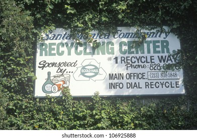 CIRCA 1988 - A Sign For The Santa Monica Community Recycling Center Obscured By Leaves